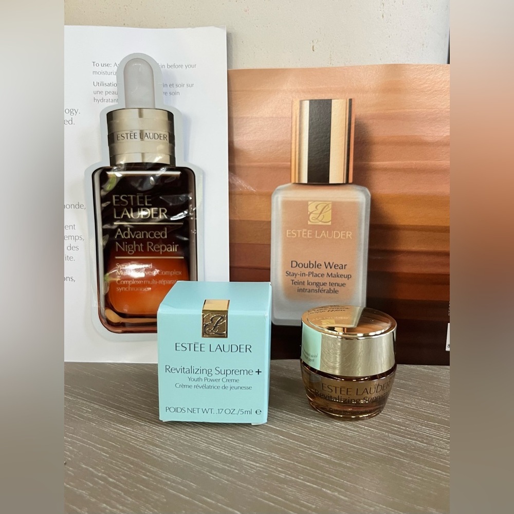 Estee Lauder skincare set in gold, mint, amber
